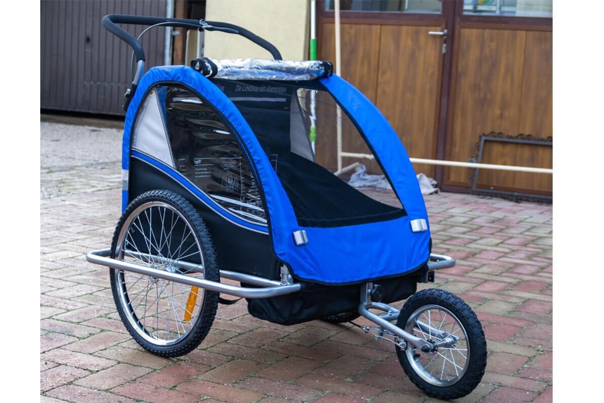 Az utánfutó tartozéka a jogging szett. Fogantyú és első kerék.