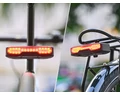 Ravemen NT101 akkus hátsó lámpa vezeték nélküli kezelővel féklámpa és index funkcióval dudával és riasztóval 160 lumen fényerővel