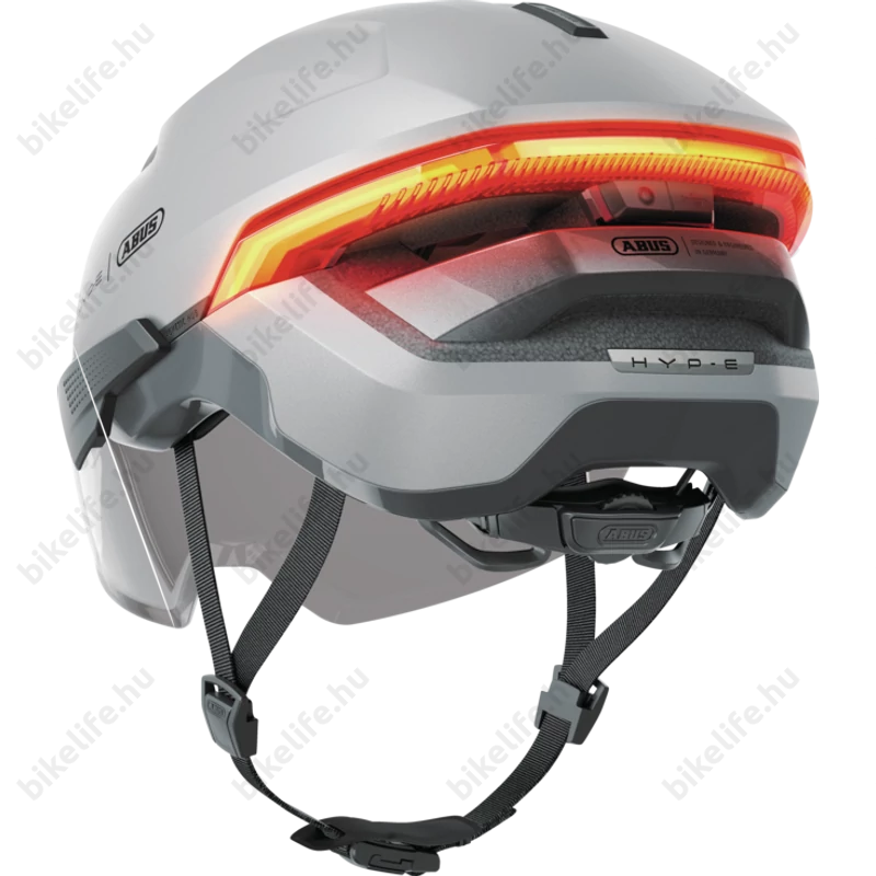 Abus HYP-E ACE kerékpáros bukósisak első és hátsó világítással index jelzővel mágneses lencsével gleam silver S (51-55cm)