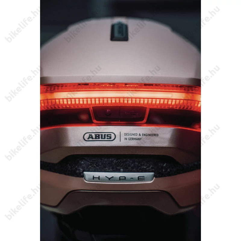 Abus HYP-E kerékpáros bukósisak első és hátsó világítással index jelzővel gleam silver M (54-58cm)
